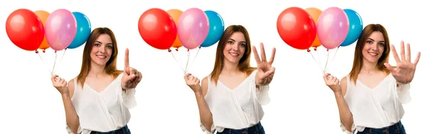 Set von schönen jungen Mädchen, die einen Luftballon halten und einen zählen, — Stockfoto