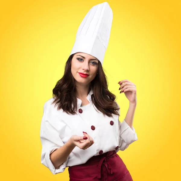 Hermosa mujer chef sobre fondo colorido —  Fotos de Stock