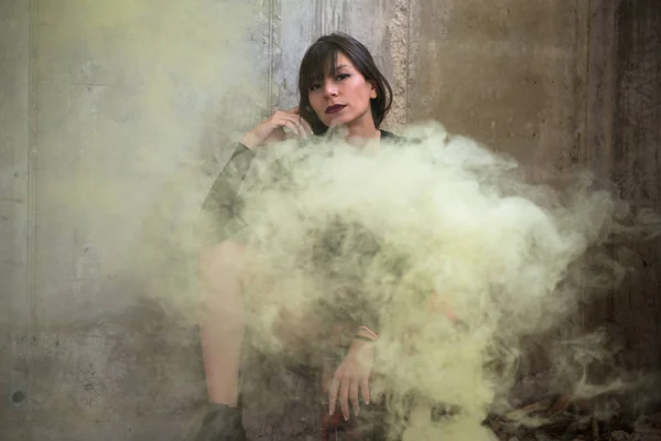 Beautiful young girl with smoke bomb — Stock Photo, Image