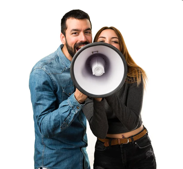 Uomo e donna con un megafono in mano — Foto Stock