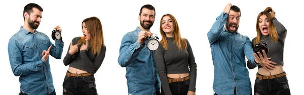 Conjunto de homem e mulher segurando relógio vintage — Fotografia de Stock