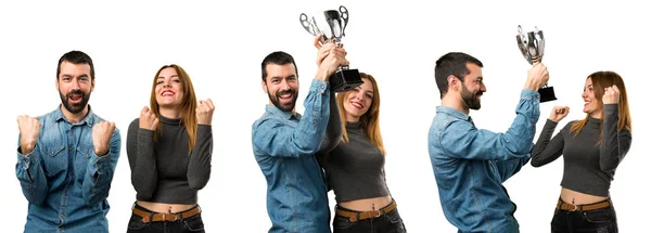 Set of Man and woman holding a trophy — Stock Photo, Image