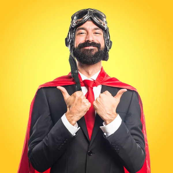 Super hero businessman with thumb up — Stock Photo, Image