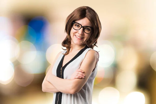 Brunette woman with her arms crossed — Stock Photo, Image