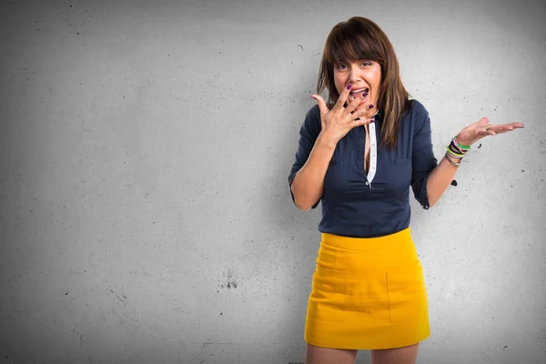 Pretty woman doing surprise gesture — Stock Photo, Image