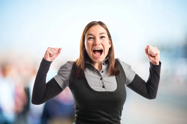 Succesvolle jonge mooie vrouw op witte achtergrond — Stockfoto