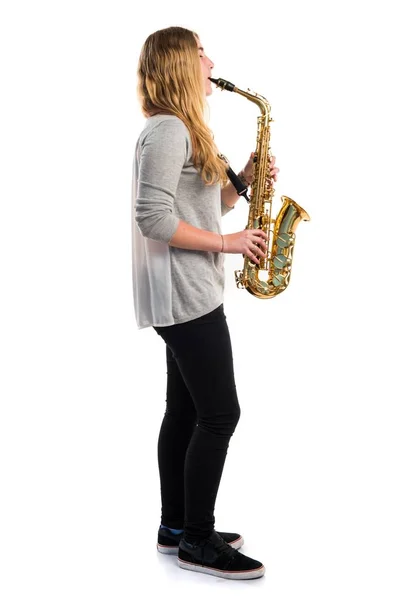 Girl playing the saxophone — Stock Photo, Image