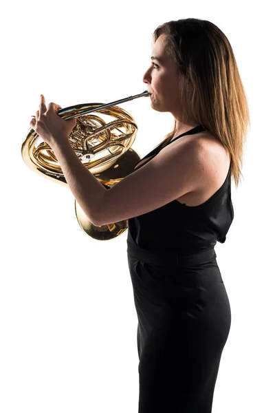 Lány játszik a francia horn — Stock Fotó