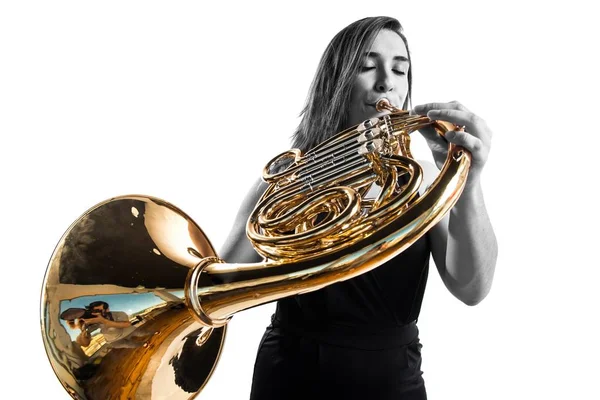 Girl playing the french horn — Stock Photo, Image