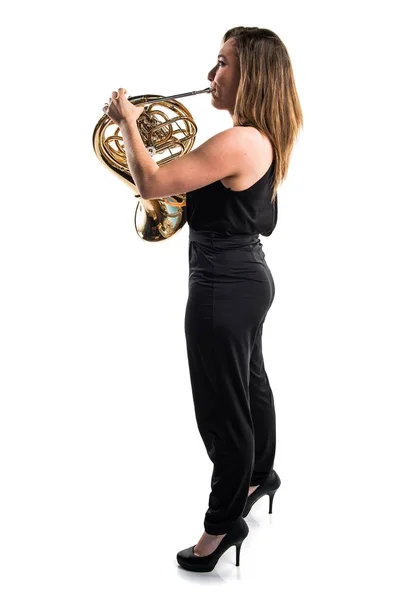 Girl playing the french horn
