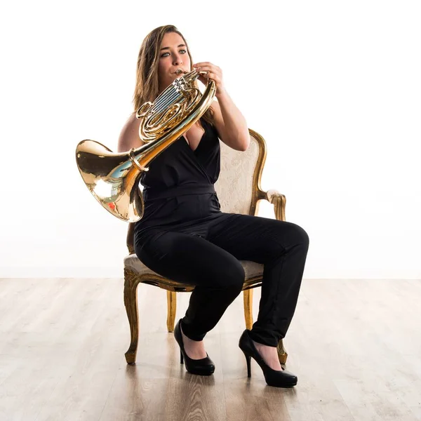 Girl playing the french horn