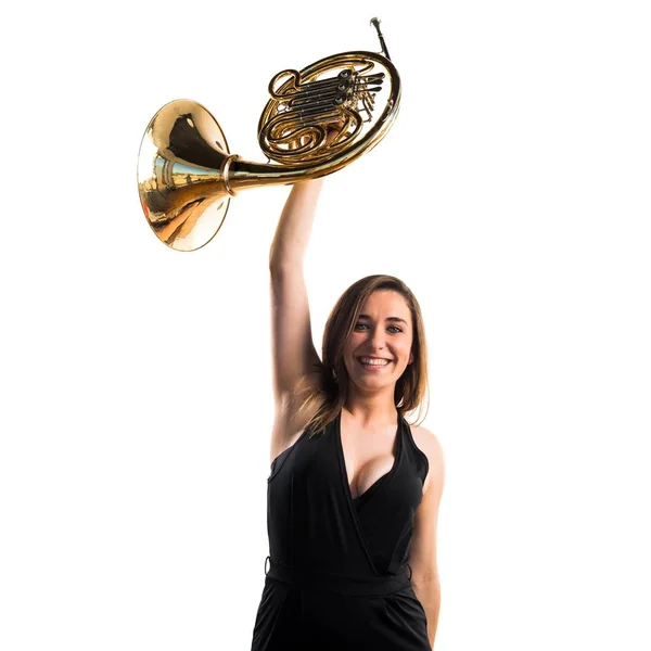 Girl playing the french horn