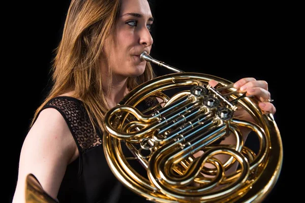 Girl playing the french horn