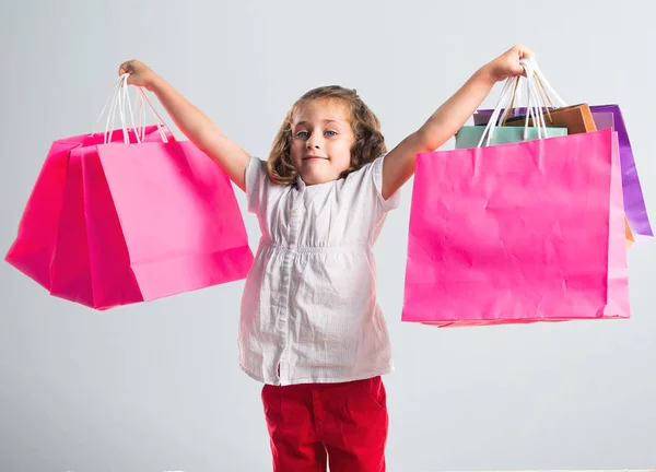 Menina com muitos sacos de compras — Fotografia de Stock