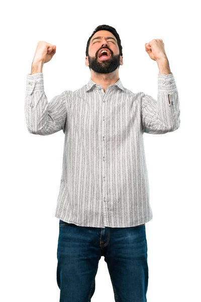 Hombre guapo con barba celebrando una victoria — Foto de Stock