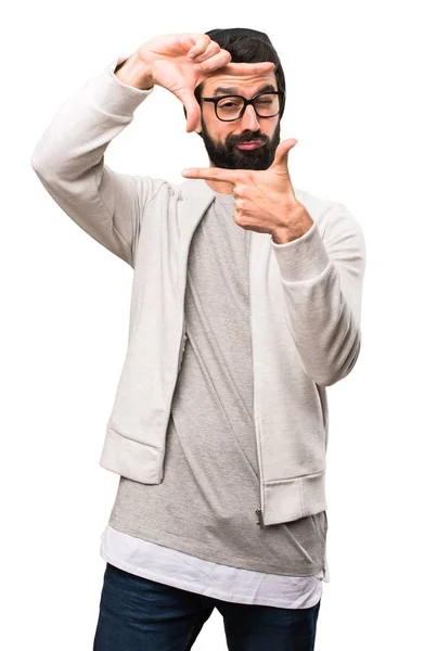 Hipster man focusing with his fingers on white background — Stock Photo, Image