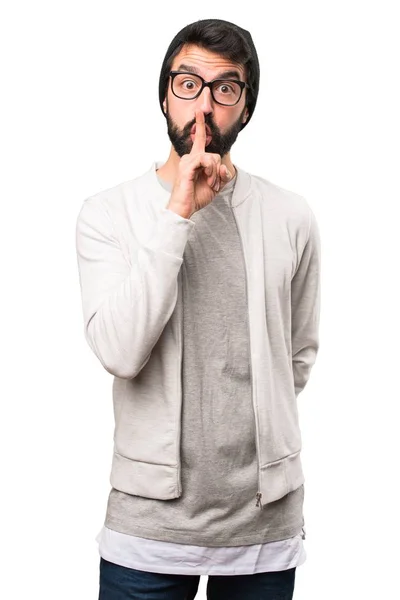 Hipster man making silence gesture on white background — Stock Photo, Image