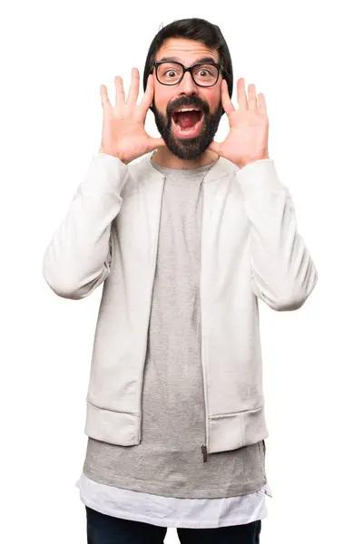 Hipster man making surprise gesture on white background — Stock Photo, Image