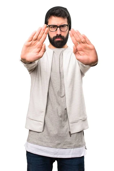 Hipster man making stop sign on white background — Stock Photo, Image