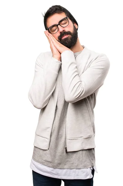 Hipster man maken slaap gebaar op witte achtergrond — Stockfoto