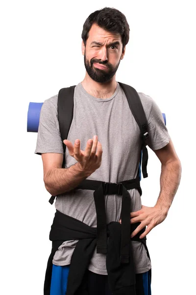 Tired handsome backpacker on white background — Stock Photo, Image