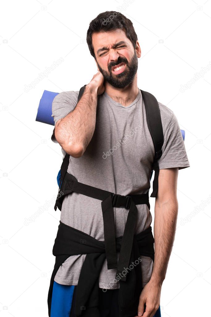 Handsome backpacker with neck pain on white background