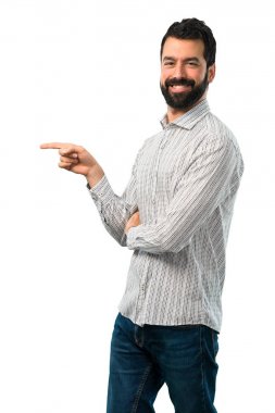Yakışıklı adam yan ve presenti sakal işaret parmağı