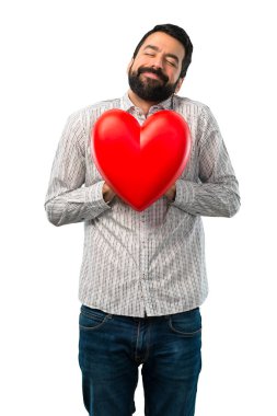 Tutmak bir kalp oyuncak sakallı yakışıklı adam