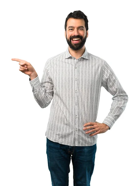 Yakışıklı adam yan ve presenti sakal işaret parmağı — Stok fotoğraf