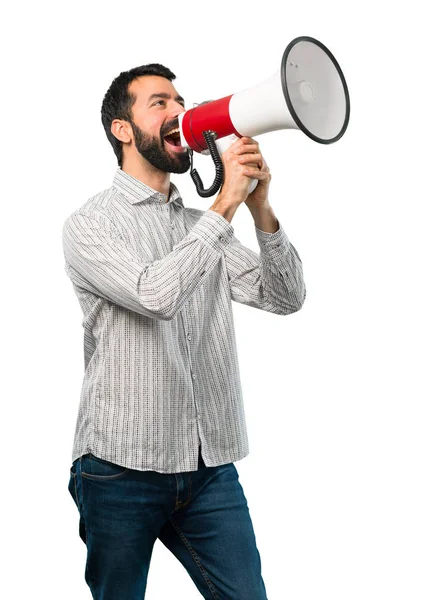 Handsome man with beard holding a megaphone — Stock Photo, Image