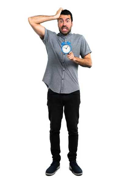 Handsome man holding vintage clock — Stock Photo, Image