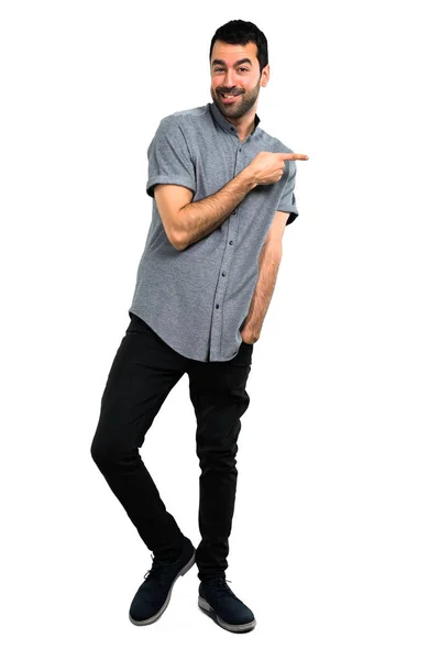 Handsome man pointing to the lateral — Stock Photo, Image