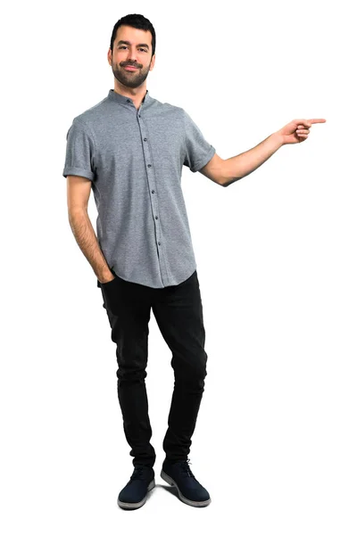 Handsome man pointing to the lateral — Stock Photo, Image
