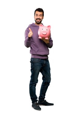 Yakışıklı bir servet izole beyaz arka plan üzerinde tutarak kazak ile tam uzunlukta atış