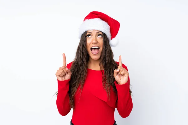 Chica Con Sombrero Navidad Sobre Fondo Blanco Aislado Señalando Con —  Fotos de Stock