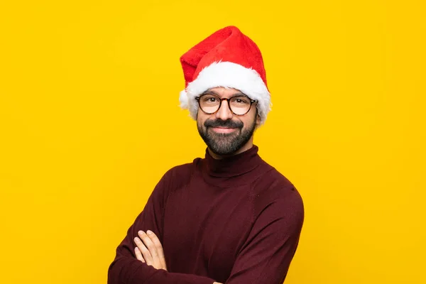 Muž Vánočním Kloboukem Přes Izolované Žluté Pozadí Brýlemi Úsměvem — Stock fotografie