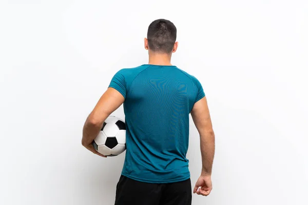 英俊的年轻足球运动员男子在孤立的白墙 — 图库照片