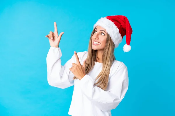 Chica Con Sombrero Navidad Sobre Fondo Aislado Señalando Con Dedo —  Fotos de Stock