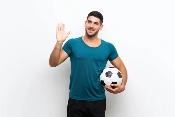 Guapo Joven Futbolista Hombre Sobre Aislado Blanco Pared Saludando Con —  Fotos de Stock