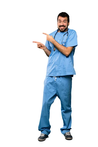 Full Length Shot Surgeon Doctor Man Frightened Pointing Side Isolated — Stock Photo, Image