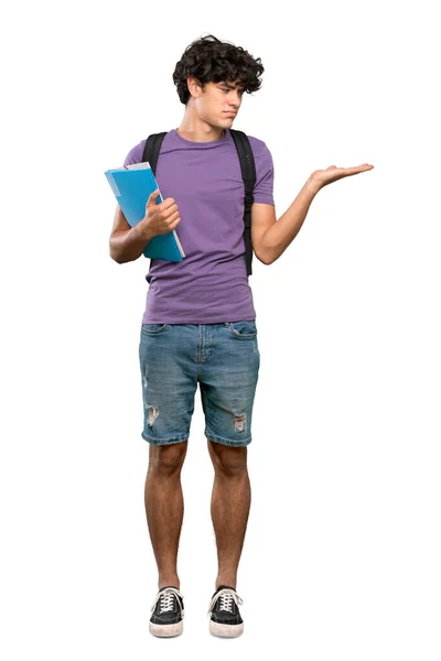 Full Length Shot Young Student Man Holding Copyspace Doubts Isolated — Stock Photo, Image