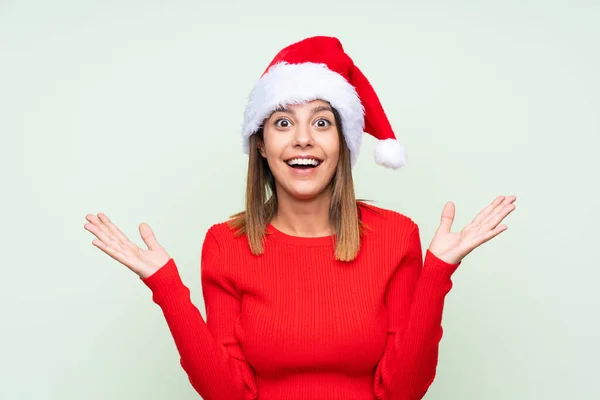 Girl Christmas Hat Isolated Green Background Surprise Facial Expression — ストック写真