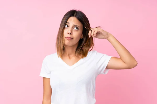 Jovem Mulher Sobre Fundo Rosa Isolado Fazendo Gesto Loucura Colocando — Fotografia de Stock