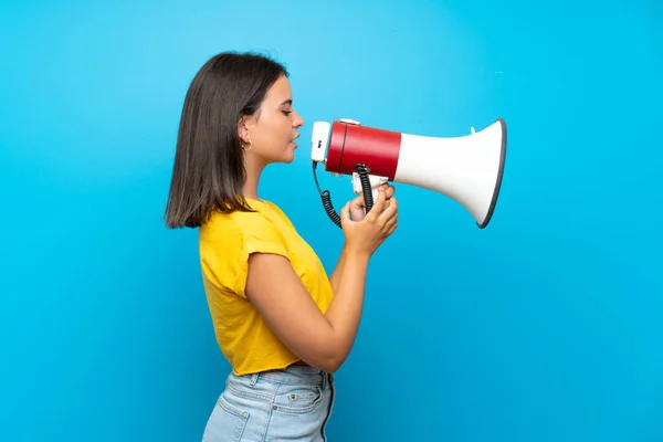 Young Girl Isolated Blue Background Shouting Megaphone — Stock Photo, Image