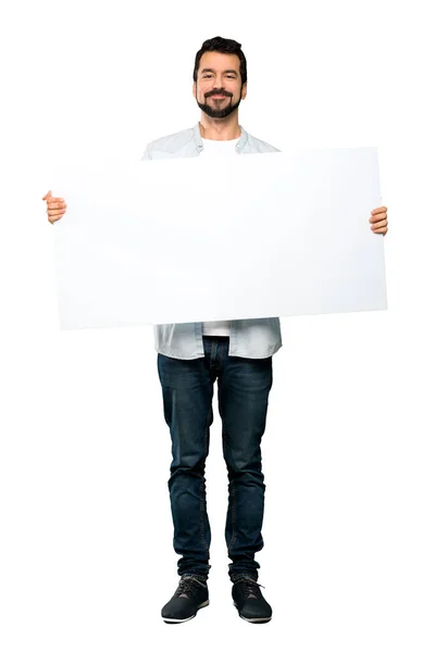 Tiro Completo Homem Bonito Com Barba Segurando Cartaz Vazio Sobre — Fotografia de Stock