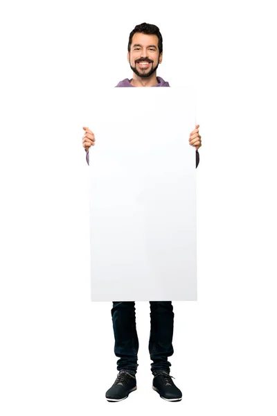 Bonito homem com camisola segurando um cartaz vazio — Fotografia de Stock