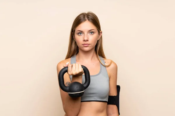 Young Blonde Sport Girl Isolated Background Making Weightlifting Kettlebell Looking — ストック写真