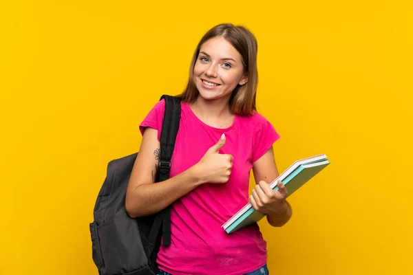 Young Student Girl Isolated Yellow Background Thumbs Because Something Good — ストック写真