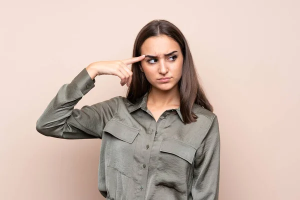 Jovencita Sobre Fondo Aislado Haciendo Gesto Locura Poniendo Dedo Cabeza —  Fotos de Stock