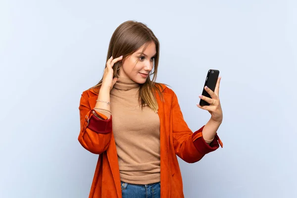 Teenager Girl Coat Isolated Blue Background Making Selfie — Stock Photo, Image